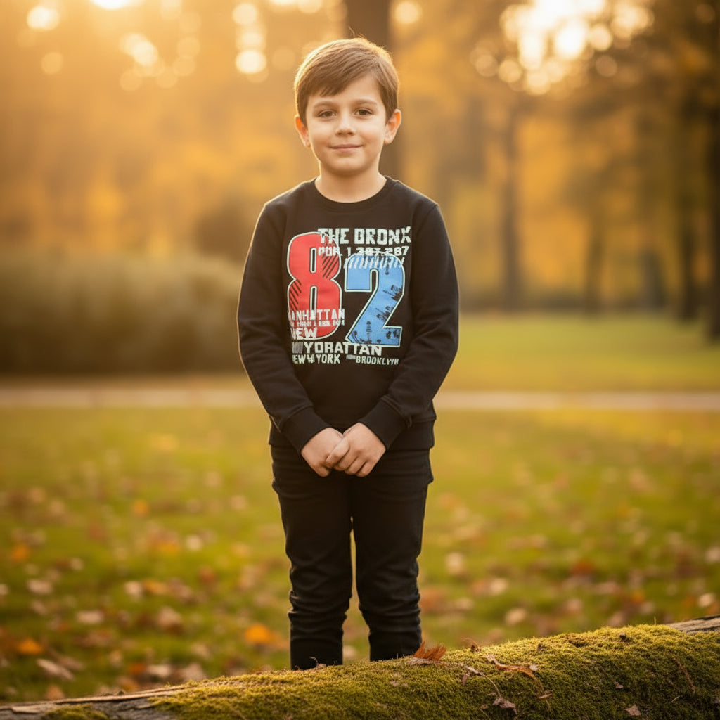 A black sweatshirt with text and graphics related to the Bronx and Manhattan areas in New York City.