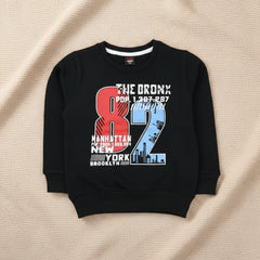 Black sweatshirt with colorful graphics and text.