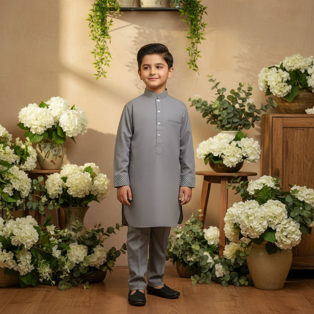 Boy's waistcoat kurta shalwar dress in gray color.