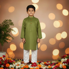 A boy's green kurta shalwar set.