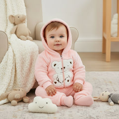 A pink baby girl teddy bear hoodie and pants set with a hoodie featuring a teddy bear design on the front and cuffed legs.