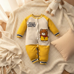 A yellow infant romper with full sleeves and legs, featuring a design with a bear and the text 'Hello Friends'.