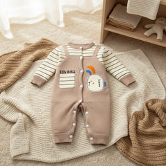 A baby romper with full sleeves and legs, beige in color, with striped patterns and a cartoon character design on the front.