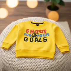 Yellow sweatshirt with 'Shoot for Your Goals'.