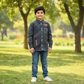 A black denim boy's full-sleeve shirt with an embroidered pattern at the front, featuring a collar and button-down neck.