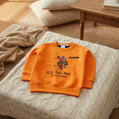 Orange sweatshirt with graphic design.