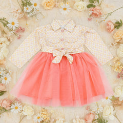 Children's dress with floral top and coral skirt