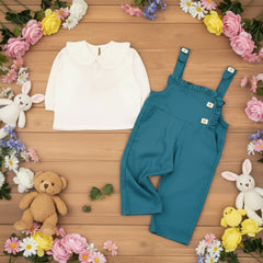 White blouse and blue overalls.