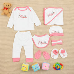A 10-piece starter set for newborn baby girls, including a white round neck shirt with embroidery, full pajamas, a hooded wrapping sheet, a bib, a cap, face towels, and pink mittens.