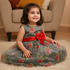 Dress with floral pattern and large red bow on a white background