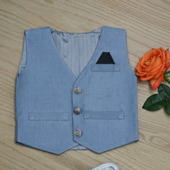 Blue vest with buttons on a wooden surface