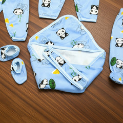Baby clothing set with panda design on a wooden surface