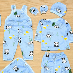 Children's blue outfit set with panda design on a wooden surface