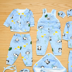 Children's blue pajama set with panda design on a wooden surface
