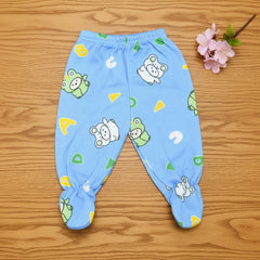 Blue baby pants with cartoon patterns on a wooden surface