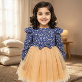 Children's dress with blue floral top and peach skirt.