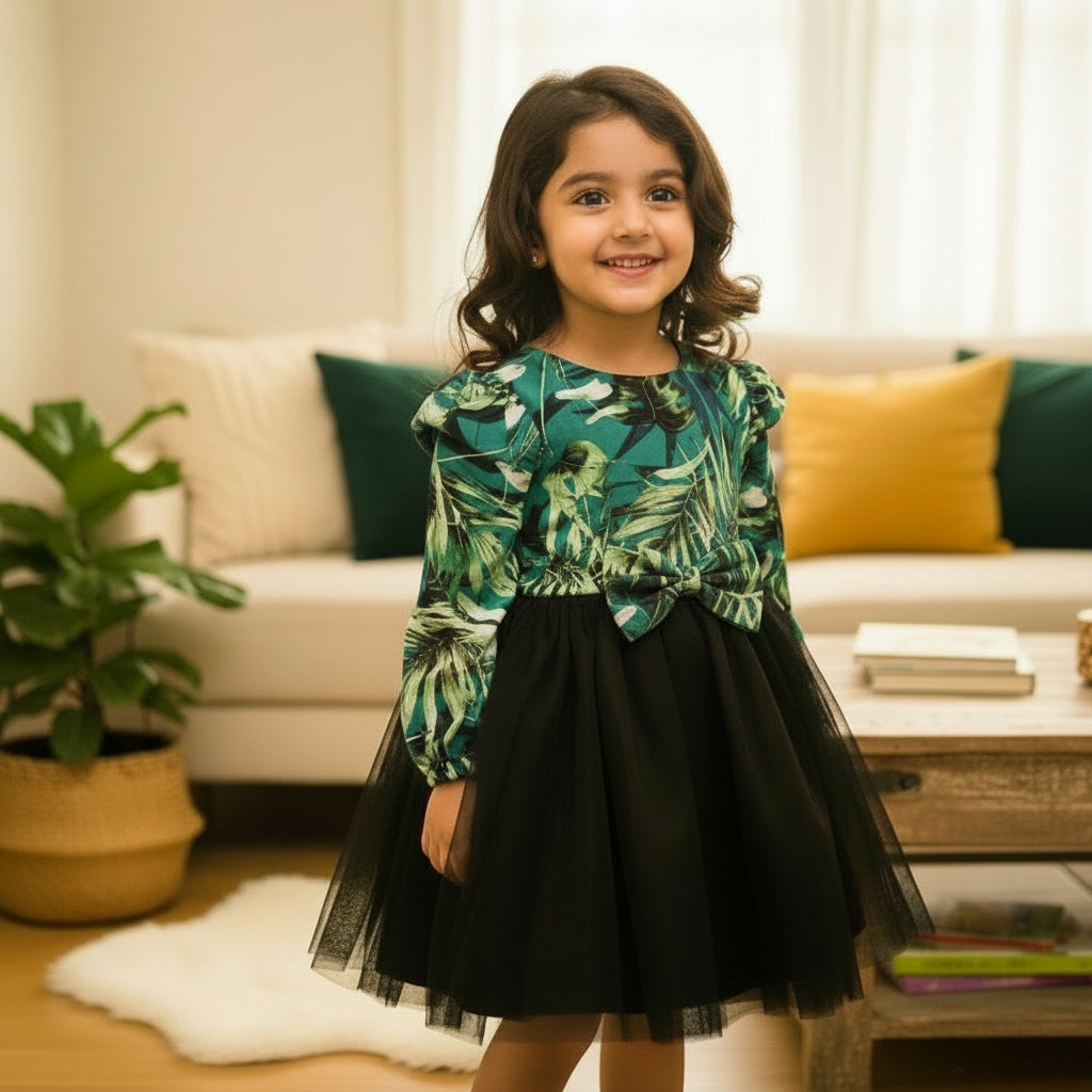 Green leaf-patterned top and black tulle skirt.