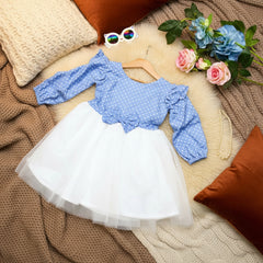 Blue polka dot blouse and white skirt.