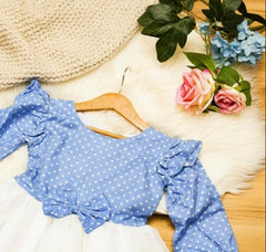 Blue polka dot blouse with ruffled sleeves