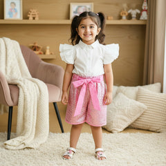 White shirt, pink sequin shorts