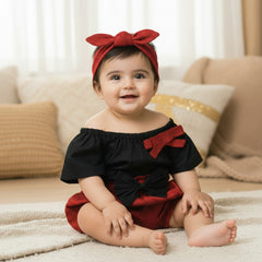 Black top with red bows, red shorts with black bows