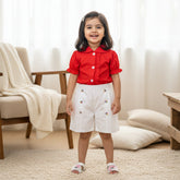 Red shirt, white shorts