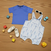 Blue t-shirt, patterned overalls