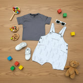 Children's clothing items including a gray t-shirt, white overalls