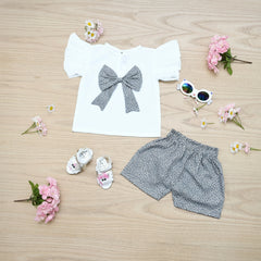 Children's outfit with white shirt, gray shorts