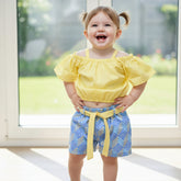 Yellow crop top, blue patterned shorts