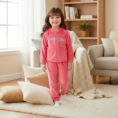 A pink baby girl's 2-piece dress with embroidered sequins and the word 'Princess' on the front