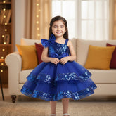 Blue dress with sequins and bows