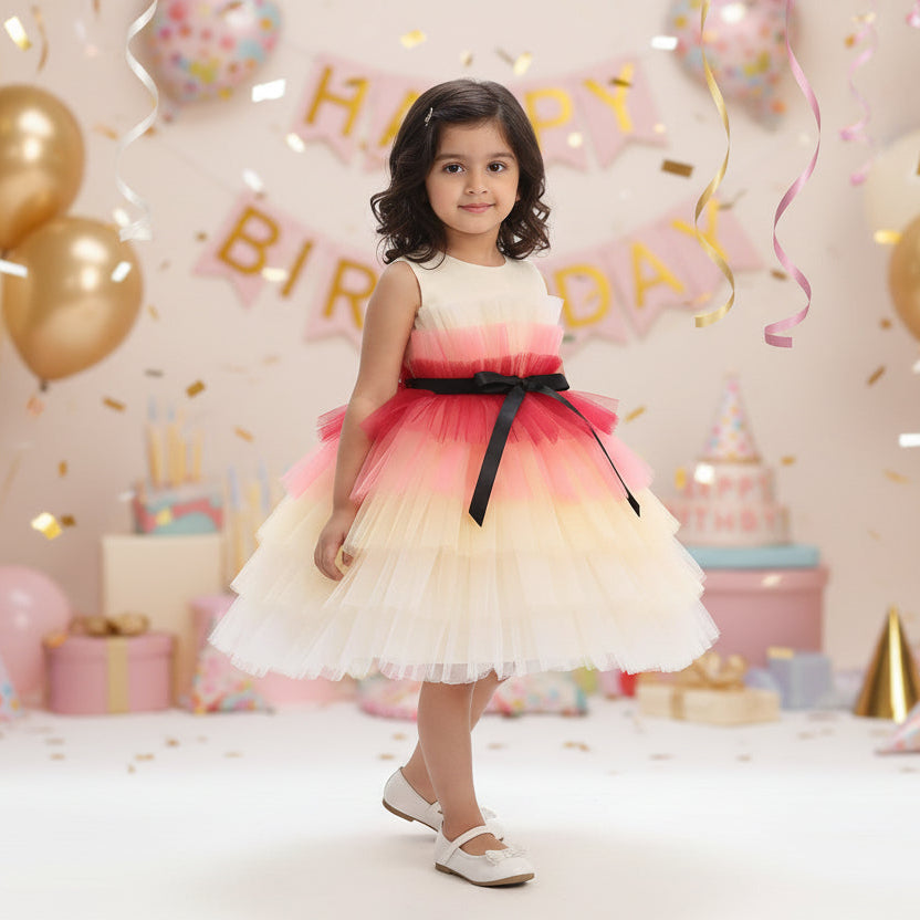 A multicolor multilayer ribbon bow knee-length frock with a round neckline and sleeveless design, predominantly in shades of peach.