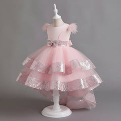 A sleeveless dress with butterfly frill sleeves and sequin detailing, featuring a flowing tail, displayed on a mannequin.