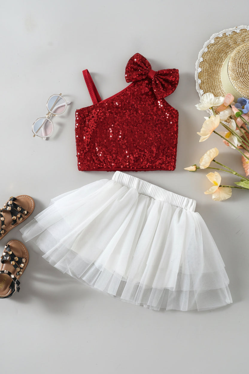 Red sequin crop top with bow and white tulle skirt