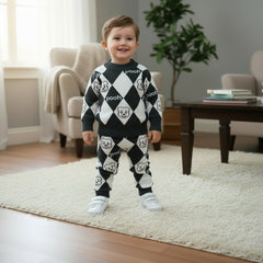 Children's outfit with black and white argyle pattern sweater and pants