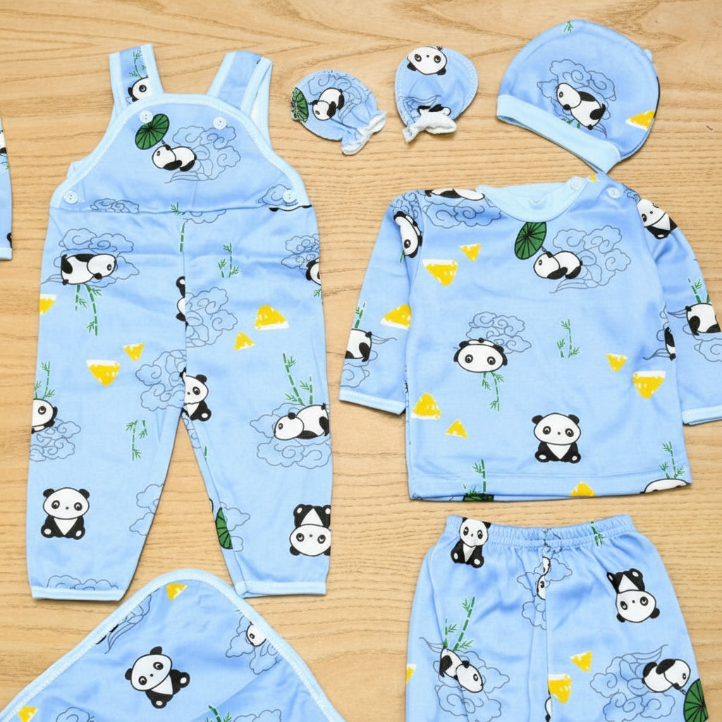 Children's blue outfit set with panda design on a wooden surface