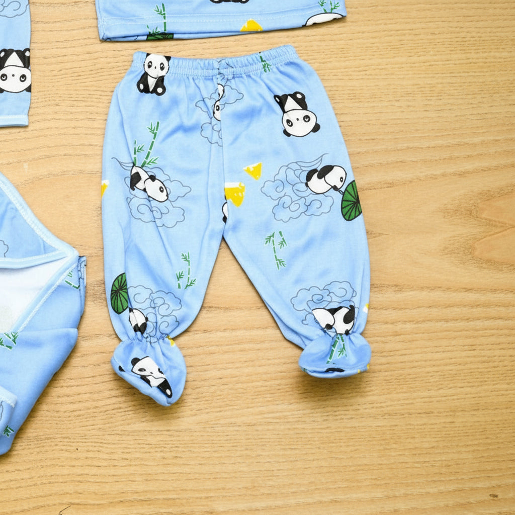 Children's blue pajama set with panda design on a wooden surface