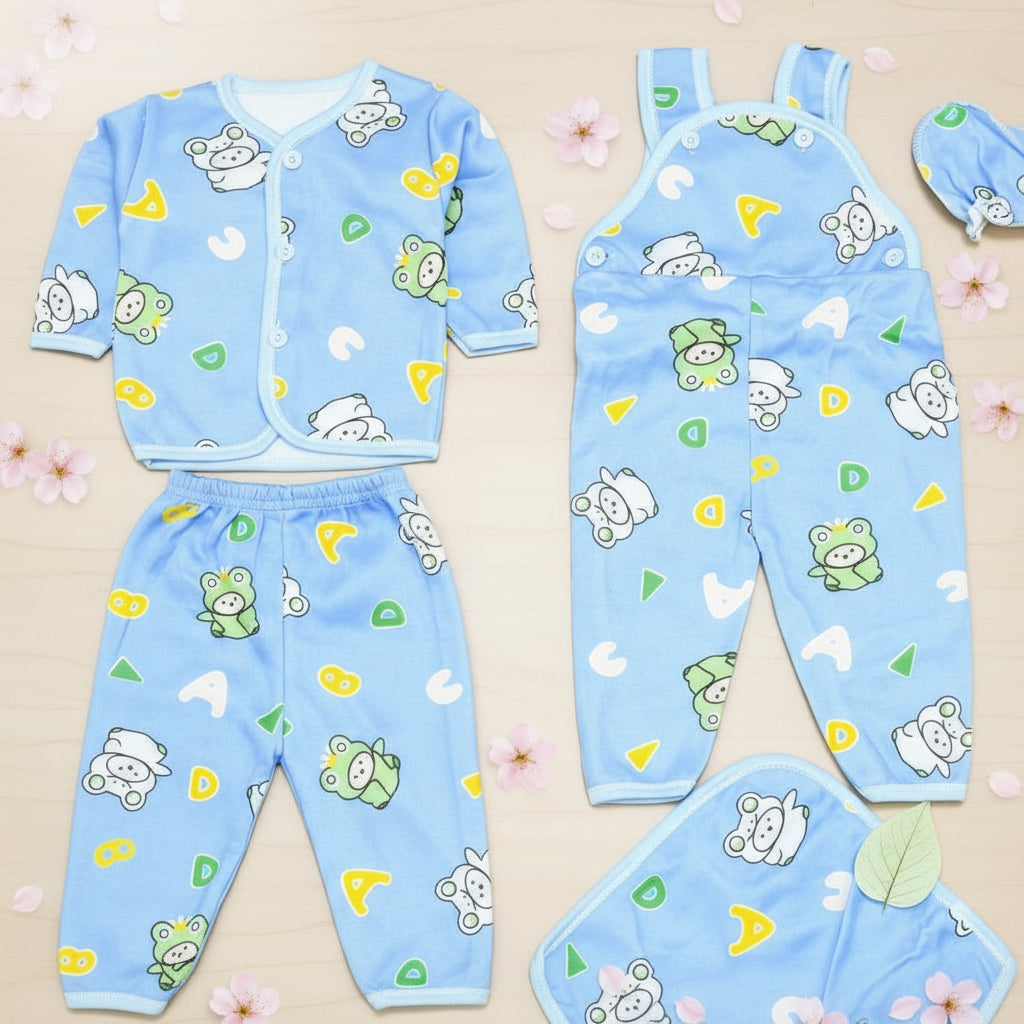 Children's blue pajama set with animal patterns on a wooden surface
