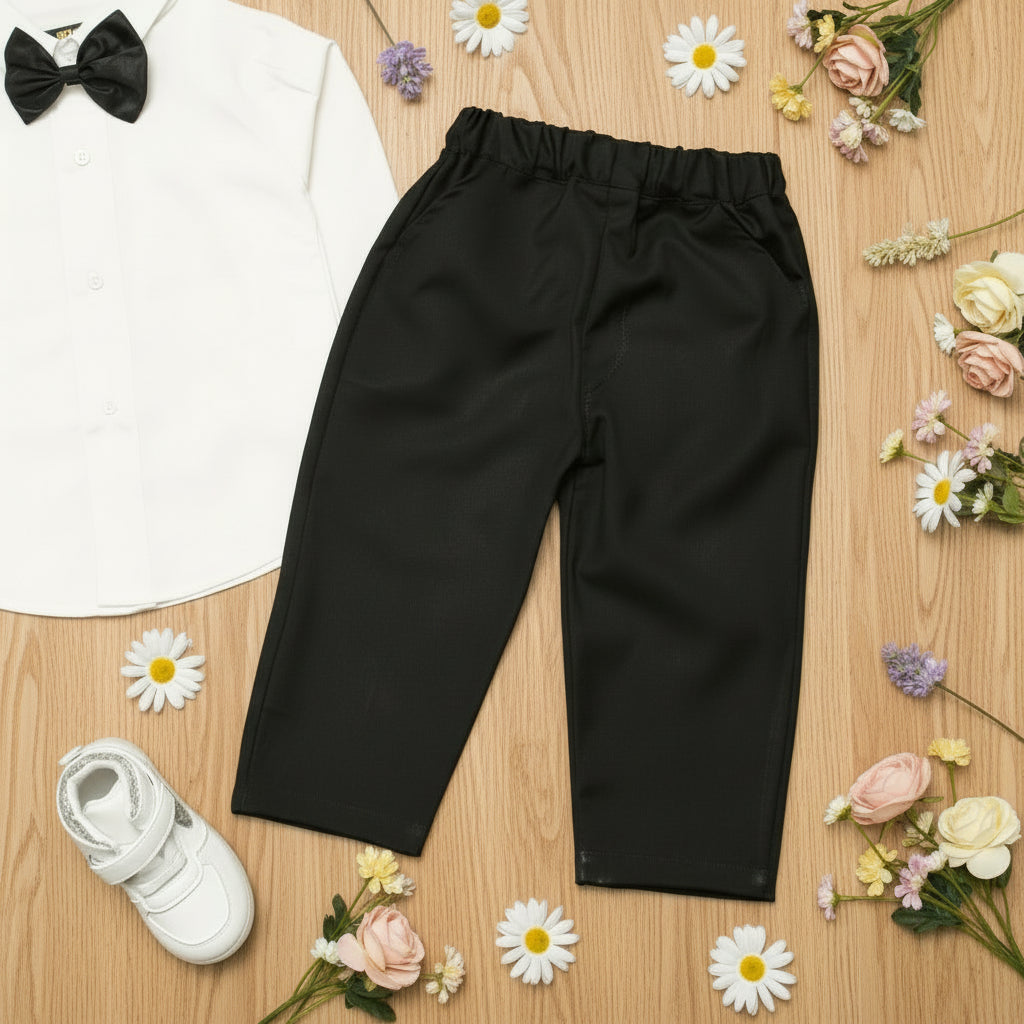 Black pants on a wooden surface with a white shirt.