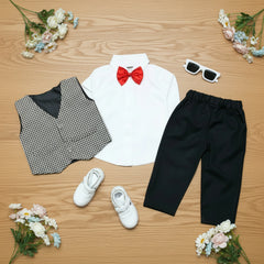 Children's outfit with white shirt, black pants, checkered vest, red bow tie.