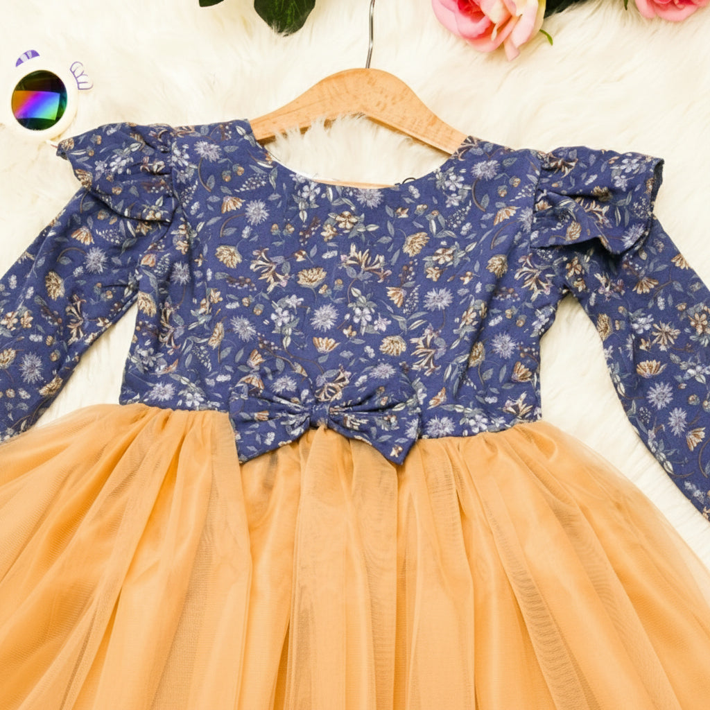 Blue floral top with ruffled sleeves and peach skirt