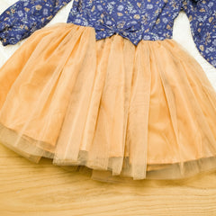Children's dress with blue floral top and peach tulle skirt