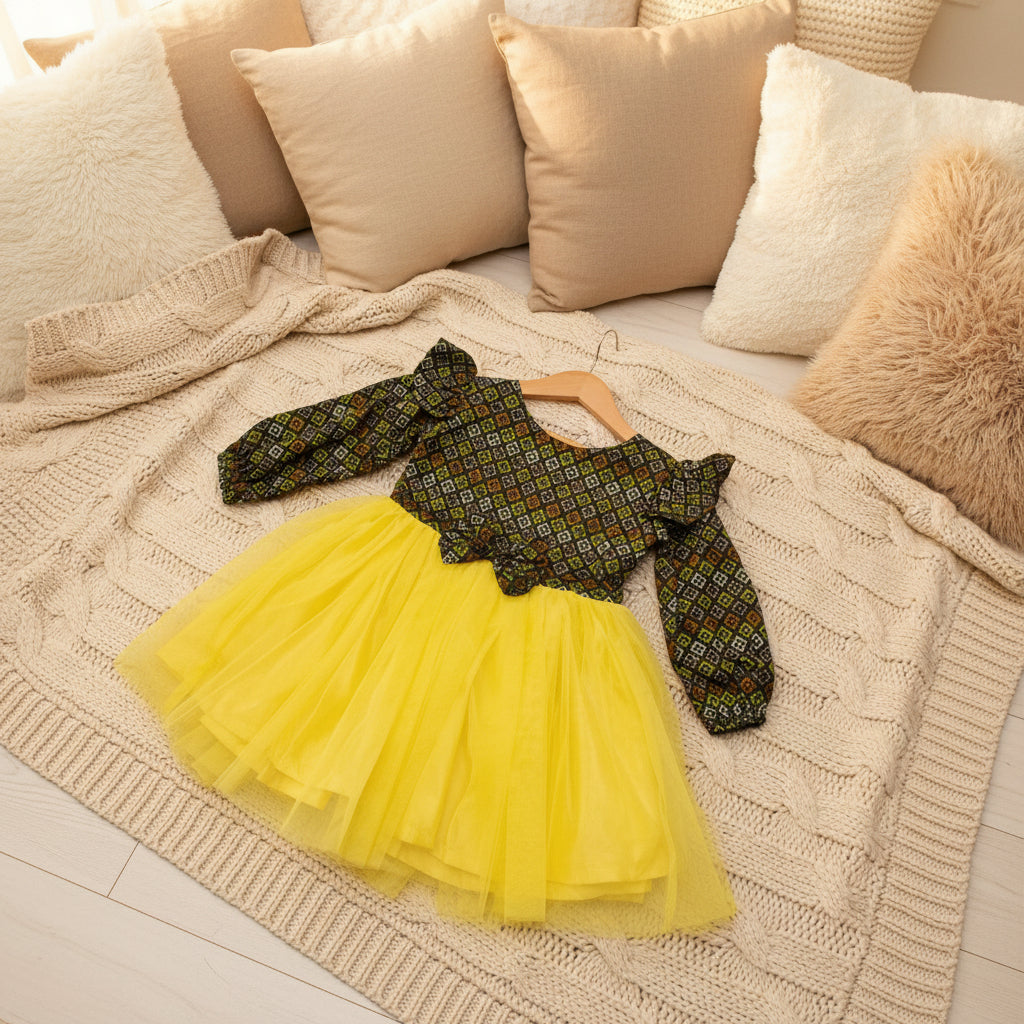 Patterned top and yellow tutu skirt.