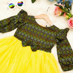 Colorful patterned top and yellow skirt