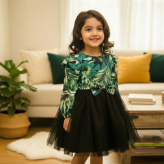 Green leaf-patterned top and black tulle skirt.