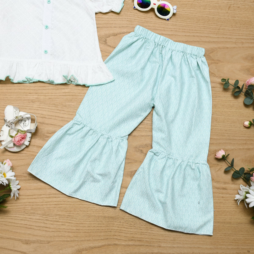 Light blue pants with ruffled bottom.
