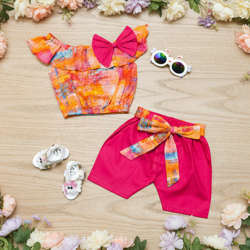 Colorful children's outfit with a top and shorts.