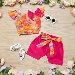 Colorful children's outfit with a top and shorts.