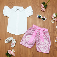 White shirt, pink sequin shorts